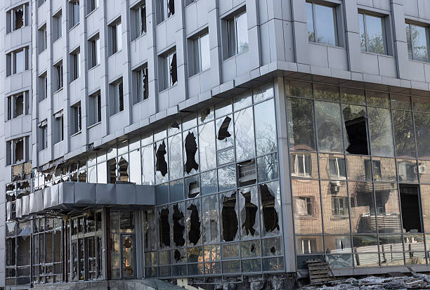 Broken windows of weapons falling into the Donetsk Modern business center of the broken system of multiple rocket launchers, Europe, Ukraine donets basin photos stock pictures, royalty-free photos & images