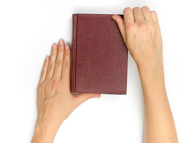 istock Hands hold blank red hardcover book on white background 508411844