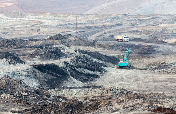 istock Part of a pit with big mining truck working 508412298