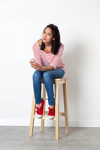 istock unhappy young multi-ethnic female student reading mobile messages 508412662