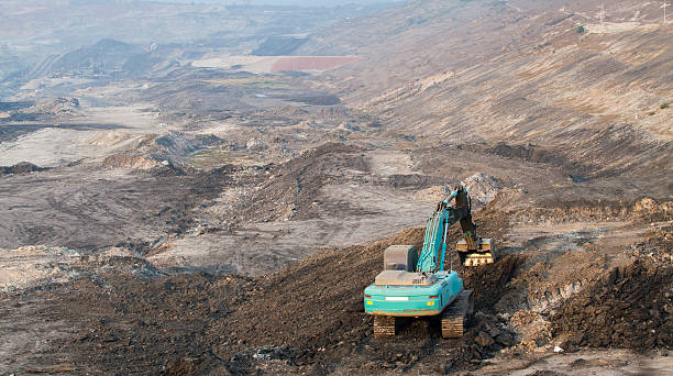 istock Part of a pit with big mining truck working 508412730
