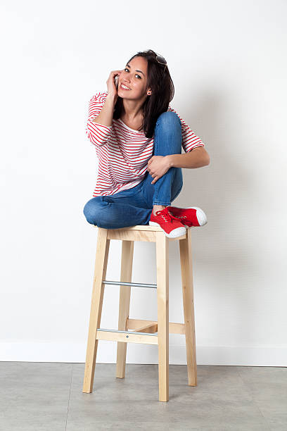 istock relaxed young multi-ethnic girl smiling on mobile phone 508412856