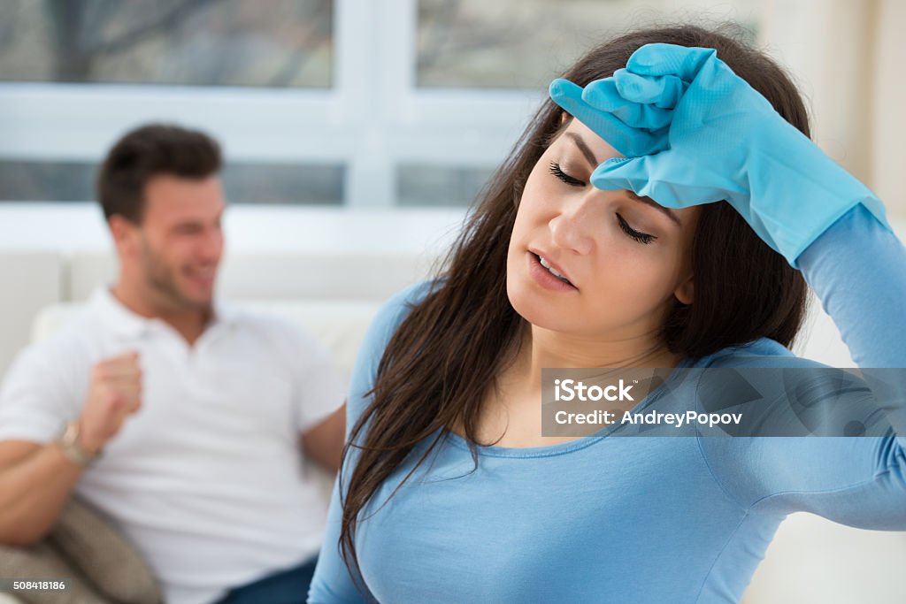 Close-up Of A Tired Woman Close-up Of A Tired Woman After House Work Adult Stock Photo