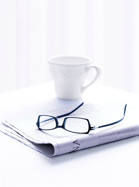 istock newspaper and glasses and coffee 508418488