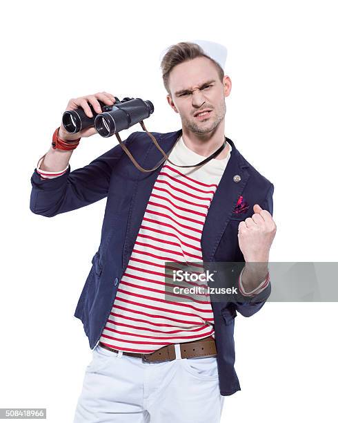 Young Sailor Man Holding Binoculars And Flexing His Arm Stock Photo - Download Image Now
