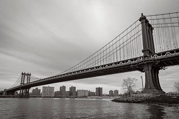 Williamsburg Bridge - B&W Photograph of the Williamsburg Bridge taken from DUMBO.  williamsburg bridge stock pictures, royalty-free photos & images