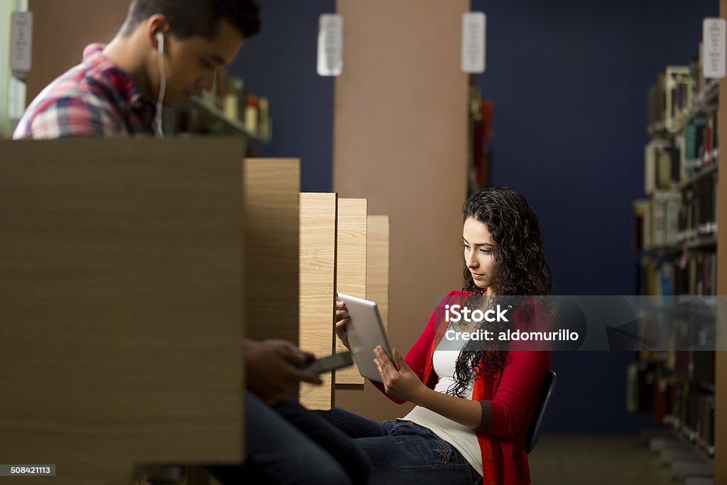 Latin students in a library A pair of latin students in a library. 20-29 Years Stock Photo