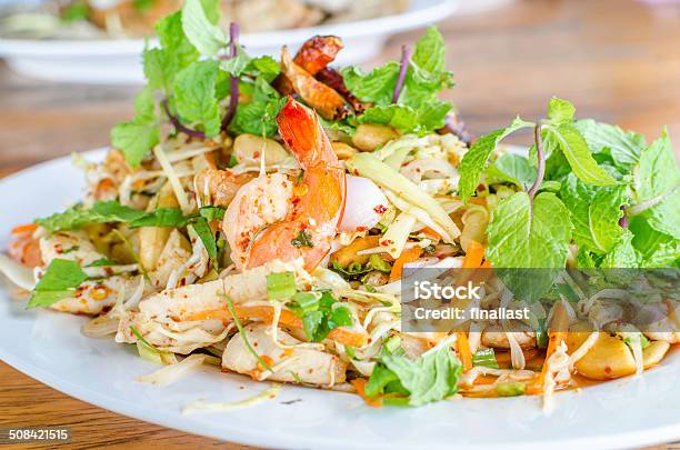 Thai Spicy Salad With Chicken Shrimp Fish And Vegetables Stock Photo - Download Image Now