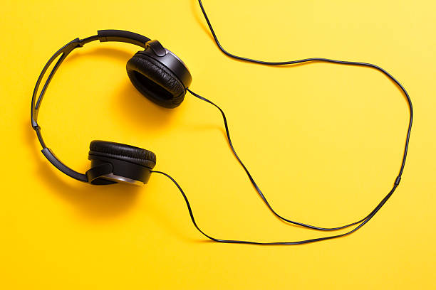 istock Headphones on yellow 508421528