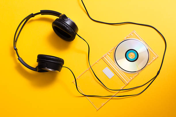istock Headphones with CD disc on yellow 508421632