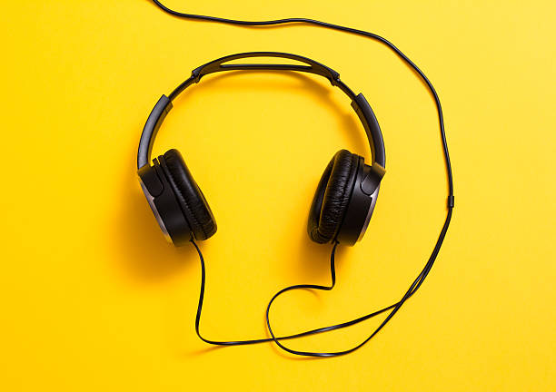 istock Headphones on yellow 508421826