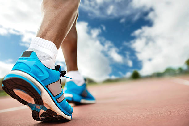 Man running Man running - close up on shoes running jogging men human leg stock pictures, royalty-free photos & images