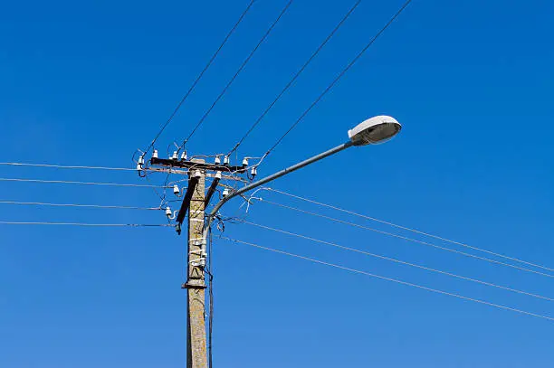 Photo of Lamppost with many electrical wires