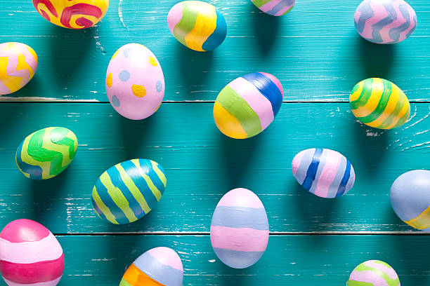 istock Colorful easter eggs on turquoise wooden table 508423300