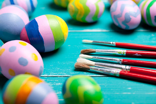 istock Colorful easter eggs on turquoise wooden table 508423380