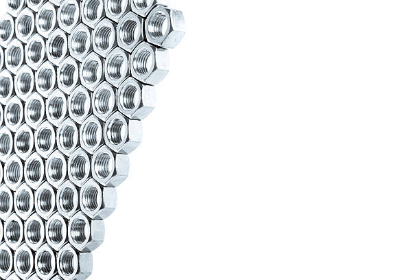 istock Nut screws tightly stacked next to each other on flat. 508423466
