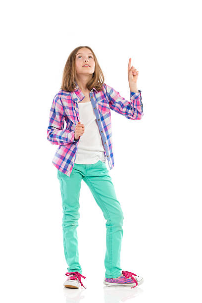 istock Little girl pointing up 508425765