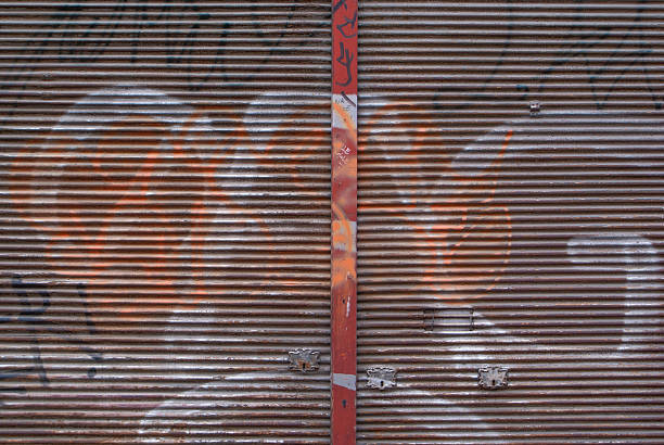 istock Old and weathered grunge steel shutter door 508425831