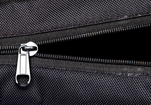 Close-up of zip on suitcase.