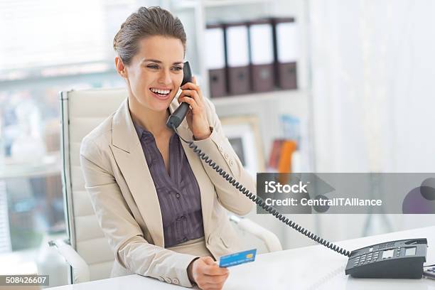 Smiling Business Woman Talking Phone In Office Stock Photo - Download Image Now - Adult, Banking, Business