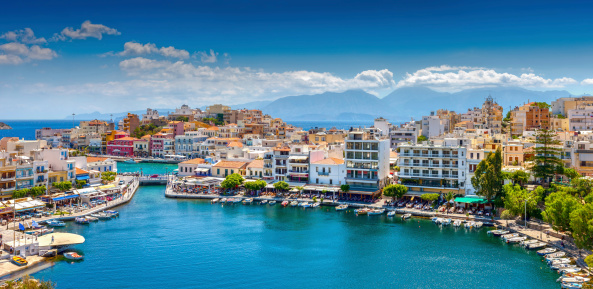Agios Nikolaos, Crete, Greece. Agios Nikolaos is a picturesque town in the eastern part of the island Crete built on the northwest side of the peaceful bay of Mirabello..