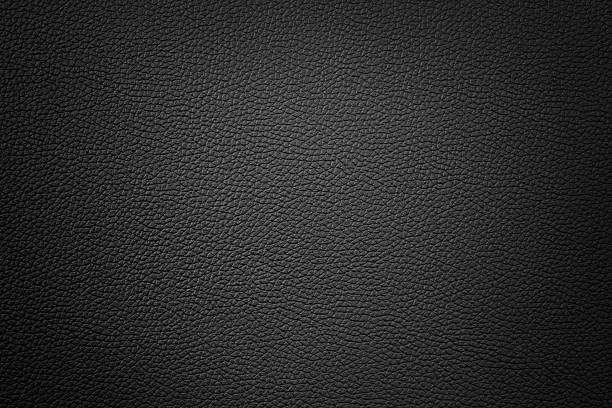 istock black color synthetic leather texture background with vignette 508441109