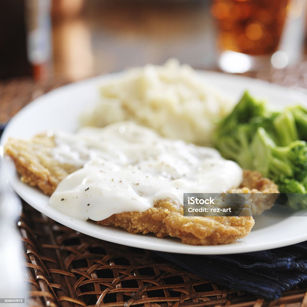 chicken fried steak chicken fried steak with southern style peppered milk gravy American Culture Stock Photo