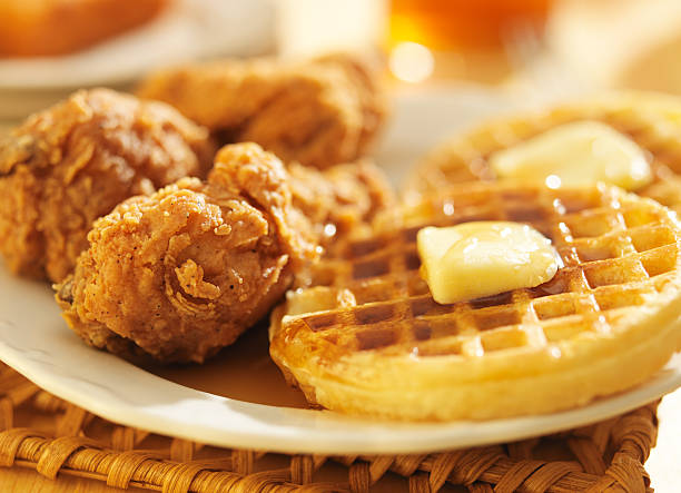 fried chicken and waffles  close up fried chicken and waffles shot in panoramic composition waffle stock pictures, royalty-free photos & images