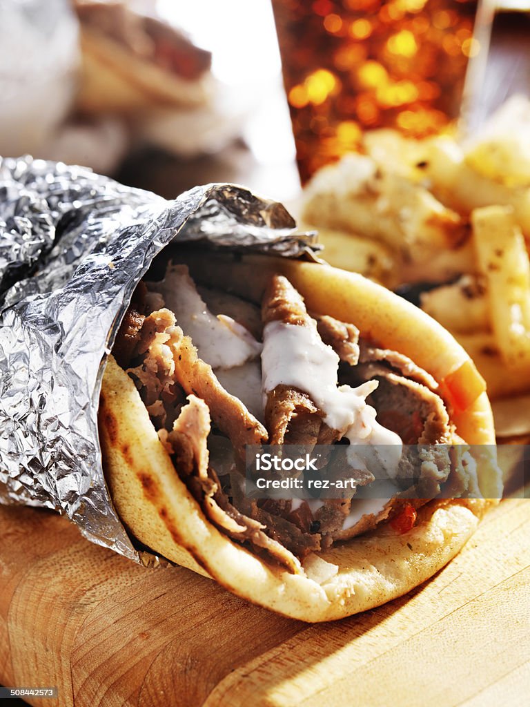 gyro with tzatziki sauce gyro with tzatziki sauce wrapped in piti with foil Foil - Material Stock Photo