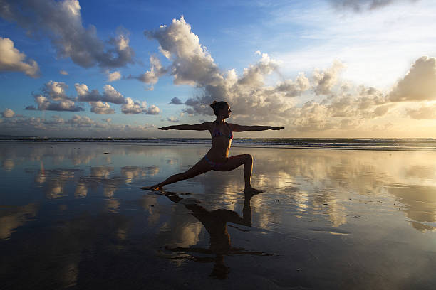 istock yoga on the beach 508442583