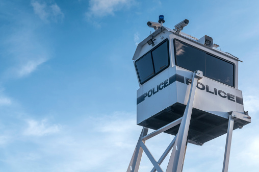 Modern police surveillance tower watching your movements.