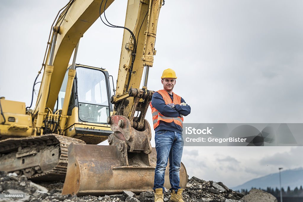 Earth Digger Driver Earth Digger Driver at construction site Heavy Stock Photo