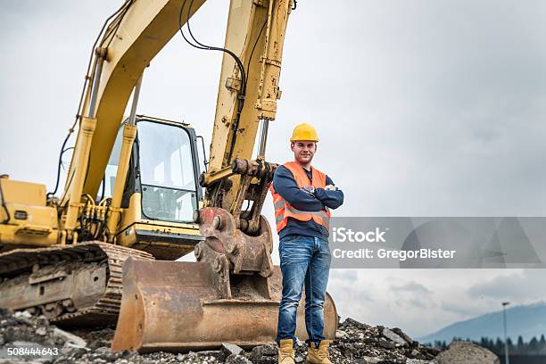 Earth Digger Driver Stock Photo - Download Image Now - Heavy, Machinery, Backhoe