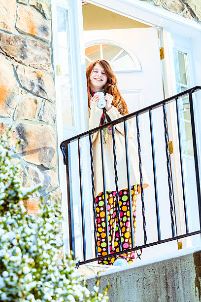 istock Girl with a cup of tea at the stoop 508446673