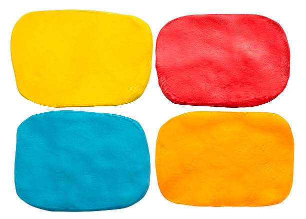 istock Blue, red, yellow and orange plasticine texture isolated on white 508449338