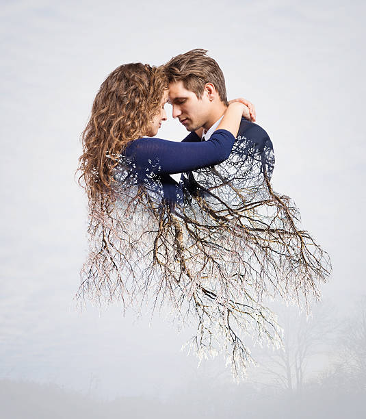 Couple in love kissing during cold winter day.
