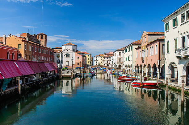 istock View over channel witn boats, houses and reflections 508451102