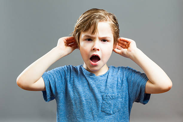 Little Boy Expressions - I can not Hear you stock photo