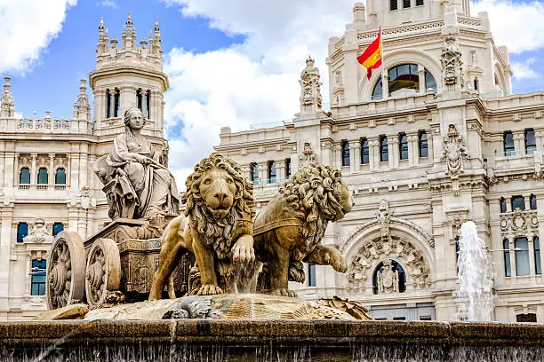 The Plaza de Cibeles is a square with a neo-classical complex of marble sculptures with fountains that has become an iconic symbol for the city of Madrid.