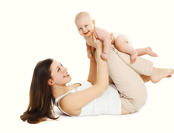 istock Happy smiling mother playing with baby on a white background 508452336