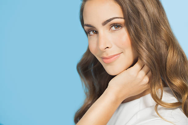 istock Smiling Woman Over Blue Background 508453516