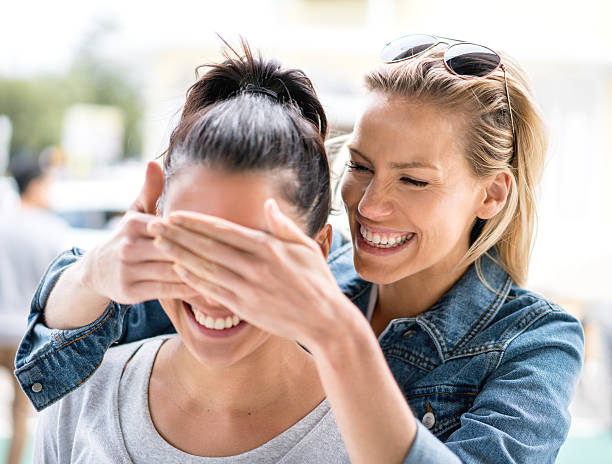 istock Woman surprising her friend 508454202