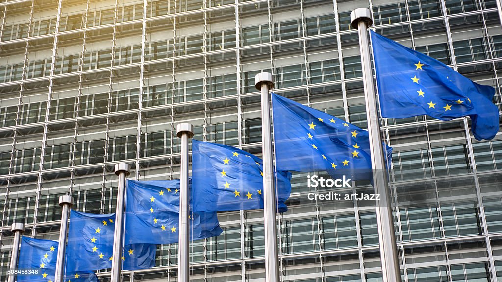 European Union flags in front of the Berlaymont European Union flags in front of the Berlaymont building (European commission) in Brussels, Belgium. Europe Stock Photo
