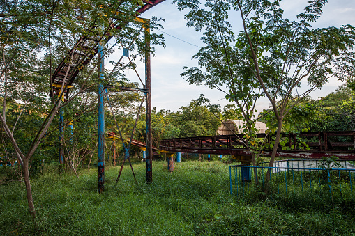 Rusting roller coaster track at Yangon abandoned amusement park