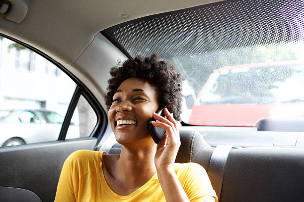 istock Smiling woman in a car talking on mobile phone 508458522