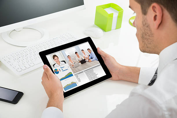 istock Businessman Videoconferencing With Colleagues On Digital Tablet 508459674