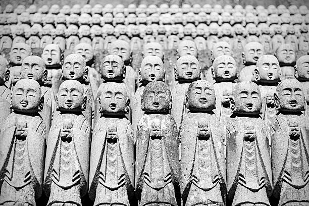 Kamakura, Japan - October 12, 2015: Close-up of rows of stone Jizo Bodhisattva statues in the Hase-dera temple in Kamakura, Japan. Jizo is special to pregnant women and to those whose children have died.