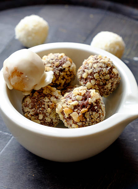 istock Homemade chocolate walnut sweets in a white bowl portrait side 508461214