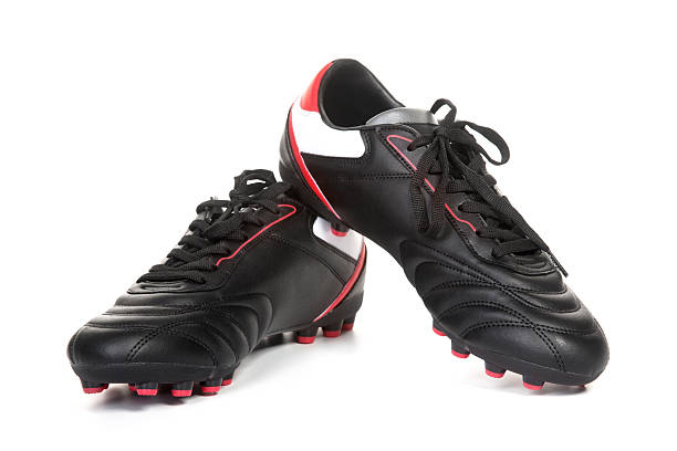 Football shoes A pair of football shoes on white background football boot stock pictures, royalty-free photos & images