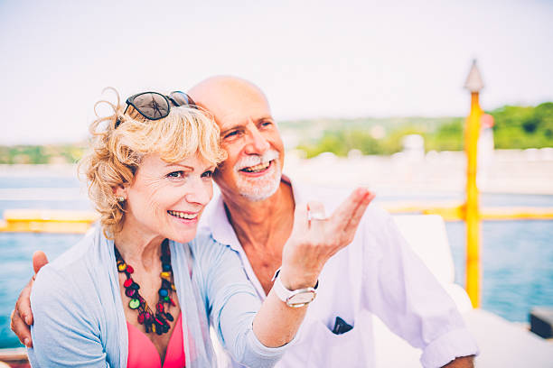 istock Senior couple having fun at sea side 508462344